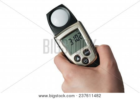 Man Holds In His Hand An Instrument For Measuring Illumination