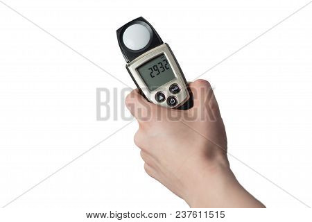 Man Holds In His Hand An Instrument For Measuring Illumination