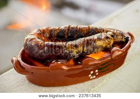 Traditional Portuguese Chourico Or Spanish Chorizo Prepared In A Special Clay Pot