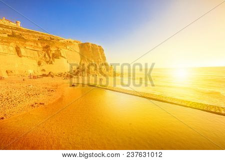 Azenhas Do Mar Beach At Sunlight, Atlantic Ocean In Portugal. Popular Portuguese Seaside Resort Near