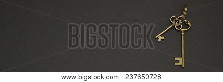 Old Golden Key On A Black Background Space For Text