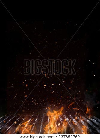 Empty flaming charcoal grill with open fire, ready for product placement.