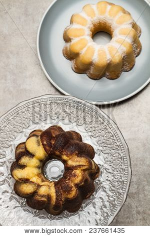 A Vanilla And Chocolate Bundt Cake And A Lemon Bundt Cake