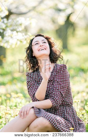 Plants, Happiness, Emotions Concept. In The Fresh Grass There Is An Dorable Woman Who Is Shrieking W