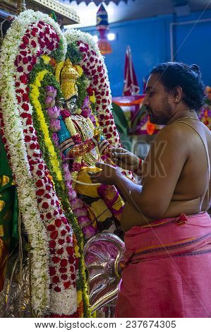 Singapore - Feb 24 : Indian Man Decorating Idol In Sri Veeramakaliamman Temple In Little India, Sing