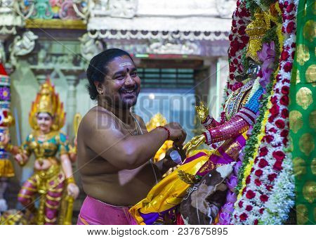 Singapore - Feb 24 : Indian Man Decorating Idol In Sri Veeramakaliamman Temple In Little India, Sing