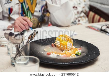 Tasting and evaluation of food by a certified specialist. A professional taster assesses the dessert