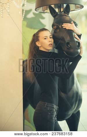 Woman With Natural Make Up And Serious Face. Sexy Girl Stands In Modern Interior. Girl Looks Sexi, F