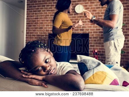 Daughter sad while her dad and mom are fighting