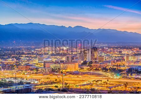 Tucson, Arizona, USA downtown skyline with Sentinel Peak at dusk.
