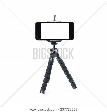 The Phone On The Tripod. Close Up. Isolated On White Background.