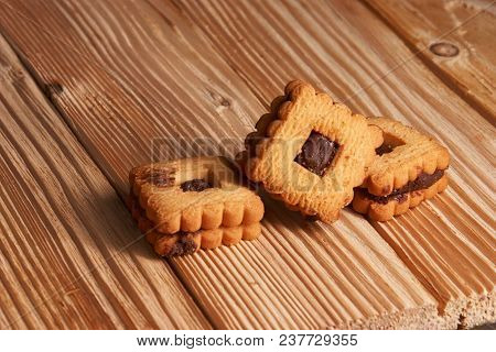 Chocolate Sand Chip Cookies Stacked Up On A Plate, Ready To Be Served.