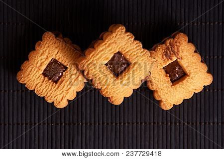 Stacked Chocolate Chip Cookies On Black Table