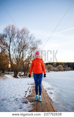 Photo Of Young Athlete Girl On Morning Exercise In Winter Park