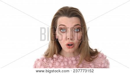 Female Face In Shock, Close Up. Portrait Young Surprised And Shockedwoman In Pink. Amazed By Surpris