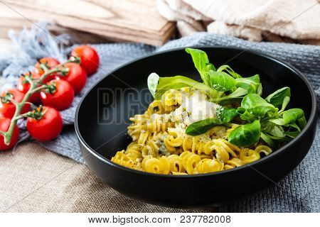 Radiatori pasta in a creamy tomato parmesan cheese sauce