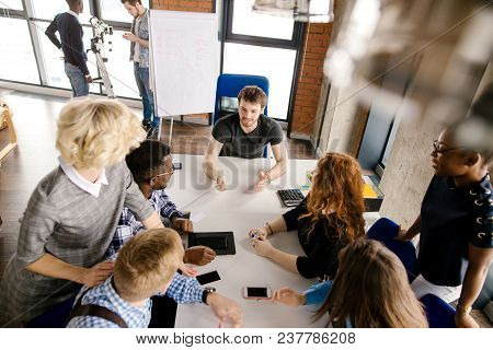 Close Up Top View Photo Of Group Of Journalists Discussing Actual News In The Office With Panorama W