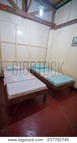 Budget Triple Hostel Room. Two Beds. Asian Country