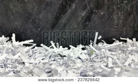 Soft Focus Macro of Shredded paper documents with black plastic background