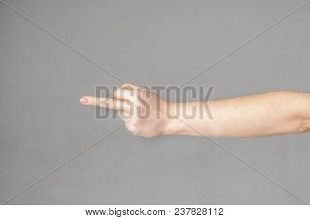 Woman Hand Showing Middle Finger On A White Isolated Background