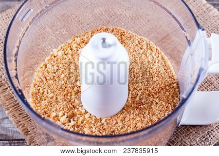 Bowl With Bread Crumbs On Wooden Table