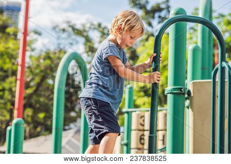 Funny Cute Happy Baby Playing On The Playground. The Emotion Of Happiness, Fun, Joy.