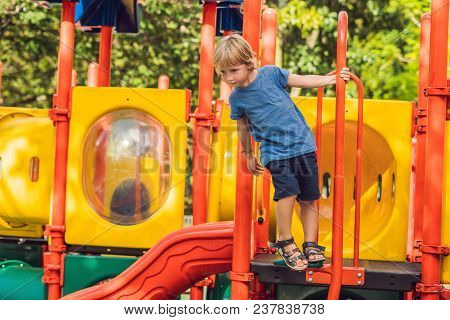 Funny Cute Happy Baby Playing On The Playground. The Emotion Of Happiness, Fun, Joy.