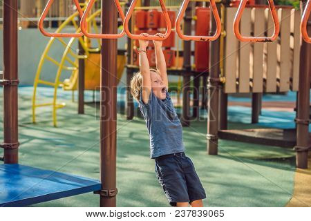 Funny Cute Happy Baby Playing On The Playground. The Emotion Of Happiness, Fun, Joy.
