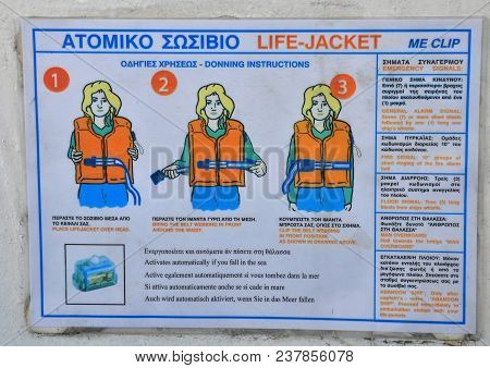 On The Sea, Greece - 21 August 2016: Instruction Desk In Greek On A Ferryboat How To Handle With A F