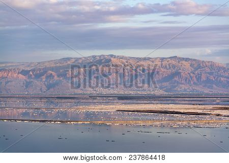 Sunset Over Lowest Salty Lake In World Below Sea Level Dead Sea, Full Of Minerals Near Luxury Vacati