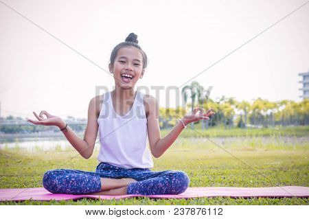 Girl's Practicing Yoga In The Park  Strengthens Concentration And Health , Yoga For Kid Have Fun Med