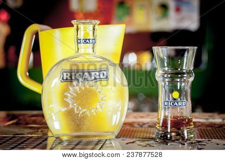 Close Up On A Ricard Jug And A Water Bottle With Its Logo. Ricard Is A Pastis, An Anise And Licorice