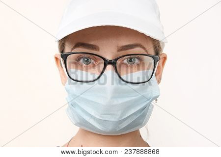 Girl In Medical Mask With Respirator On White Background.
