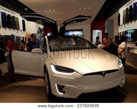 Honolulu - September 11, 2016: People Look At Model X Car Inside Tesla Store.  Tesla, Inc. Is An Ame