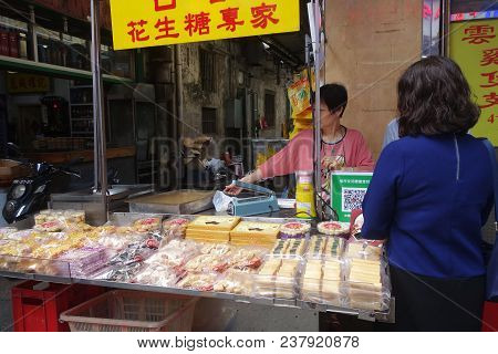 Macau, China- 10 Apr, 2018: Street Food And Snack Near Senado Square A Paved Town Square And Part Of