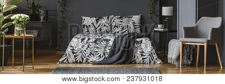 Dark Bedroom With Floral Bed