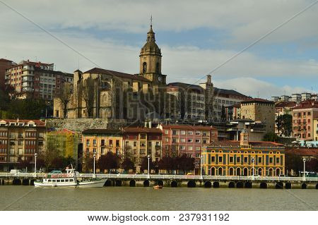 View Of The Dock And Buildings Of Porugalete At Sunrise From Getxo. Architecture History Travel. Mar