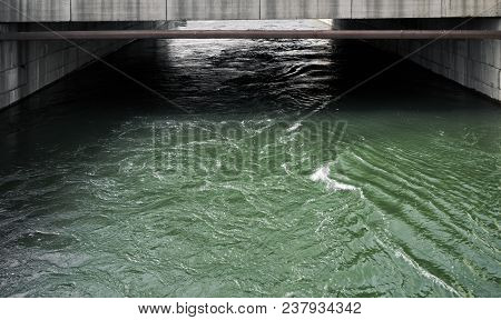 Concrete And Water. Tempestuous River In A Concrete Tunnel. Concrete Canal. River Canal