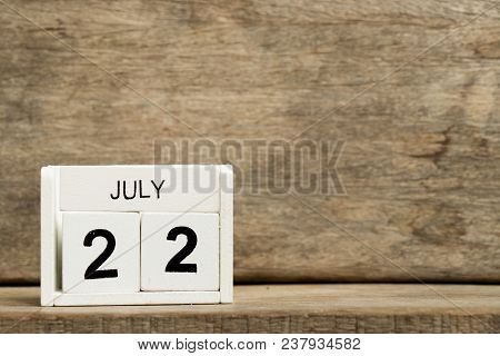 White Block Calendar Present Date 22 And Month July On Wood Background