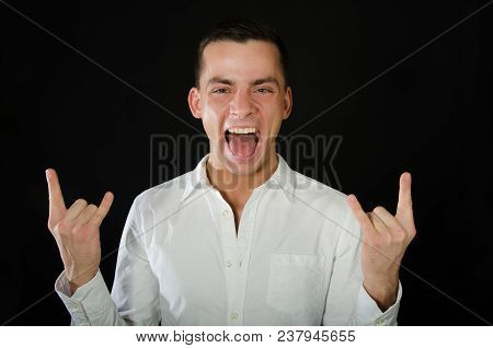 Young Handsome Guy Is Fooling Around. Emotional And Funny