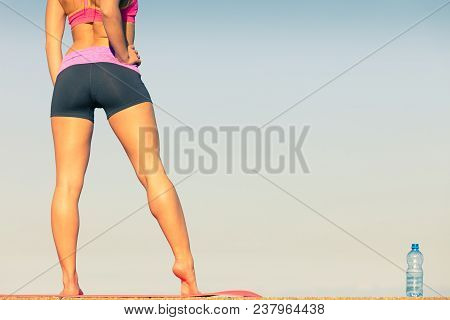 Woman In Sportswear Takes A Break To Rehydrate Drinking Water From Plastic Bottle, Resting After Spo