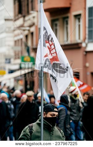 Strasbourg, France  - Mar 22, 2018: Man With Flag At Demonstration Protest Against Macron French Gov