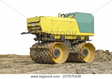 Yellow Small Compactor At A Loamy Construction Site