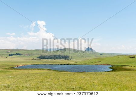 Grass And Lake Landscape On The Road To The Kaalvoet Vrou Monument At Retief Pass In The Free State 