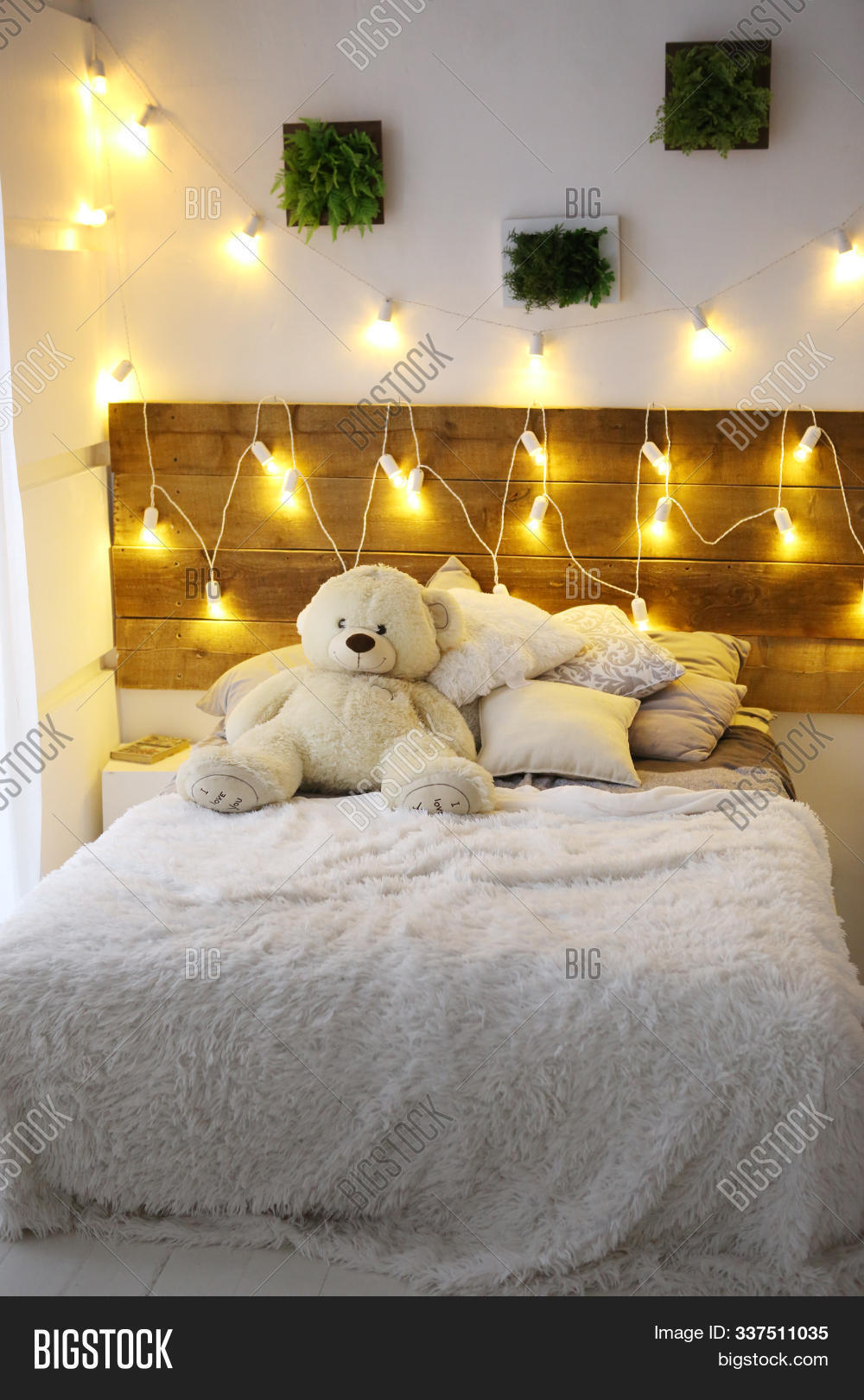 big teddy bear in bedroom