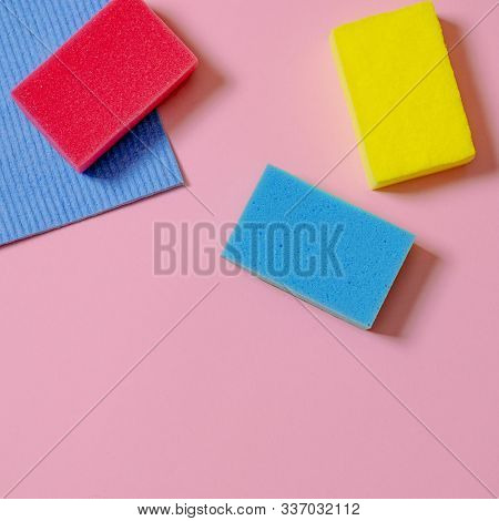 Multi-colored Inoperes For Cleaning The House On A Colored Background With A Place For Text
