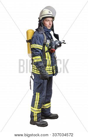 Young Fireman With A Mask And An Air Breathing Apparatus On His Back In A Fully Protective Suit Isol