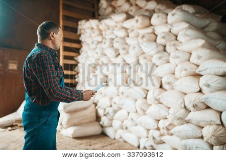 Joiner check bags of sawdust on timber mill