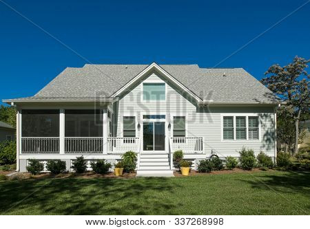 Rear elevation of beautiful home with landscaped garden.