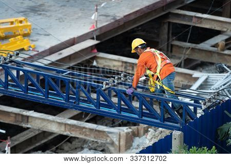 A Construction Worker Do A Job Such As Painting Welding In A Construction Site.